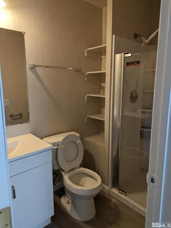 a view of cabinets and wooden floor