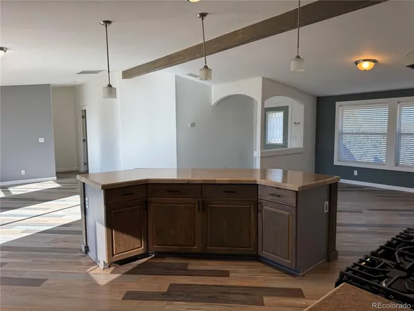 a kitchen with a refrigerator and a sink