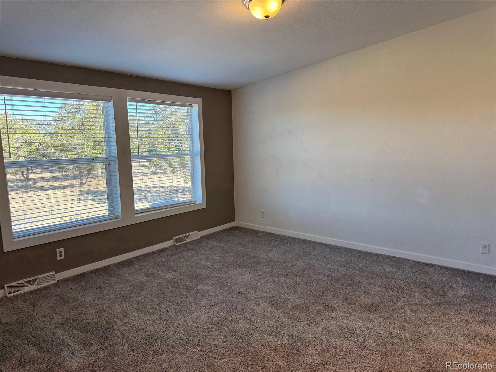 620 Falling Rock Road Cotopaxi, CO 81223 - Photo 14 of 32 an empty room with a window