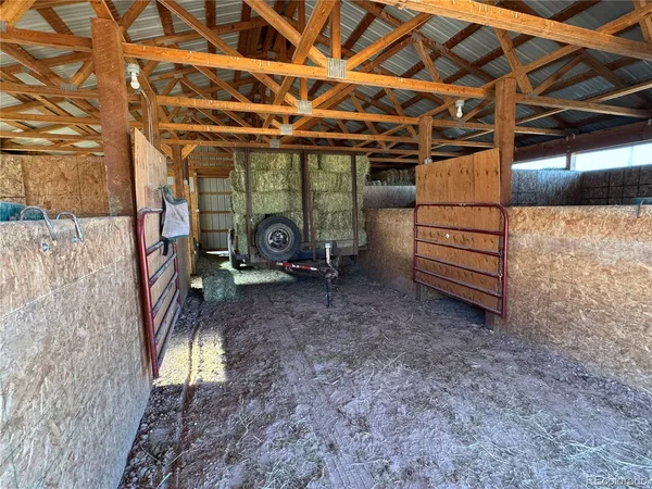 a view of a room with wooden walls