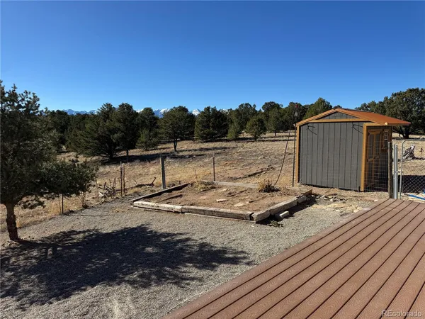 a view of a backyard with sitting area