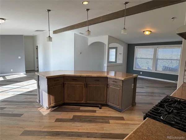 a kitchen with a refrigerator and a sink