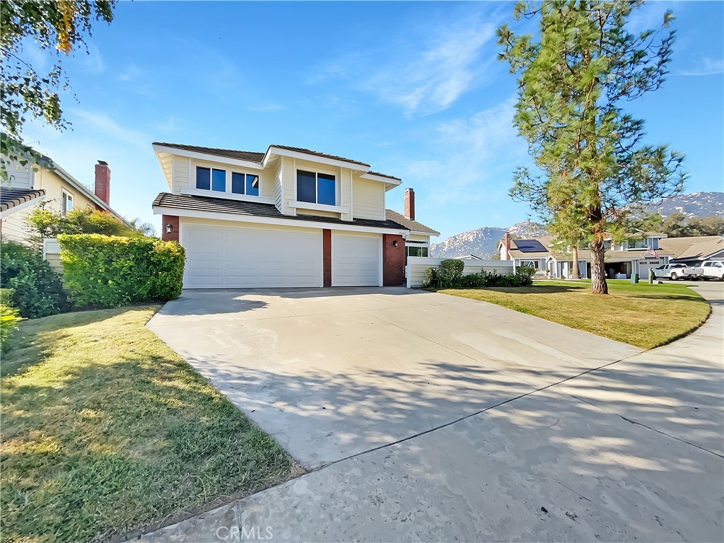 a house with yard in front of it
