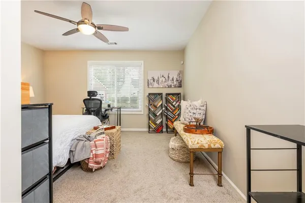 a bedroom with furniture and a window