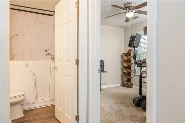 a bathroom with a shower and a toilet