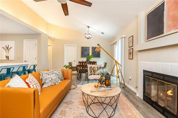 a living room with furniture and a fireplace