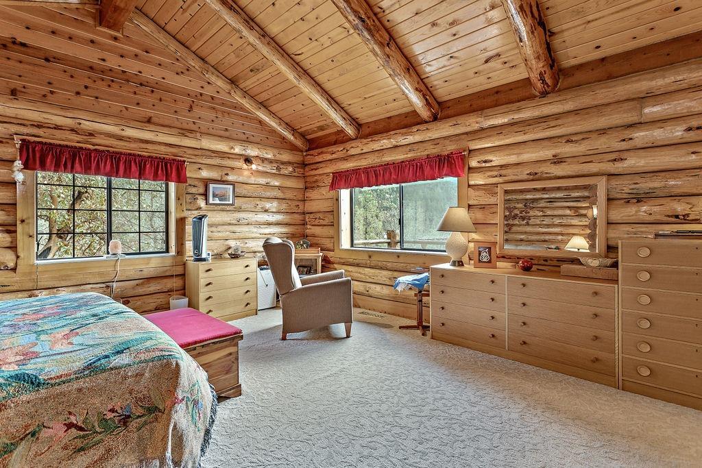 9196 Upper Applegate Road Jacksonville, OR 97530 - Photo 16 of 35 a bed room with a bed and a window