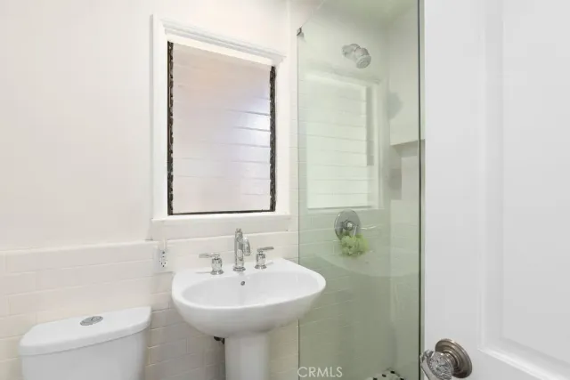 a bedroom with furniture and a wooden floor