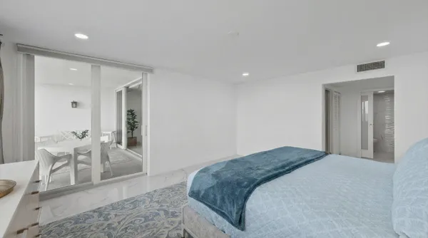 a bedroom with a bed and a table