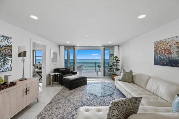 a living room with furniture window and a couch