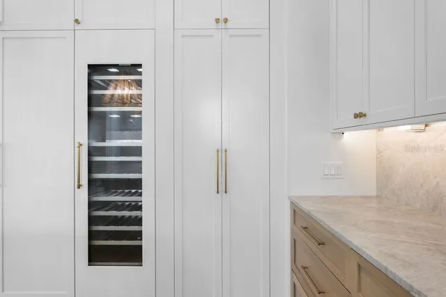 a view of a kitchen cabinets and appliances