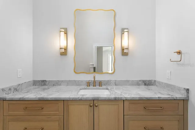 a kitchen with stainless steel appliances granite countertop a sink and dishwasher a stove top oven with white cabinets