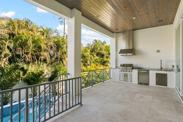 a kitchen with stainless steel appliances granite countertop a stove and a sink