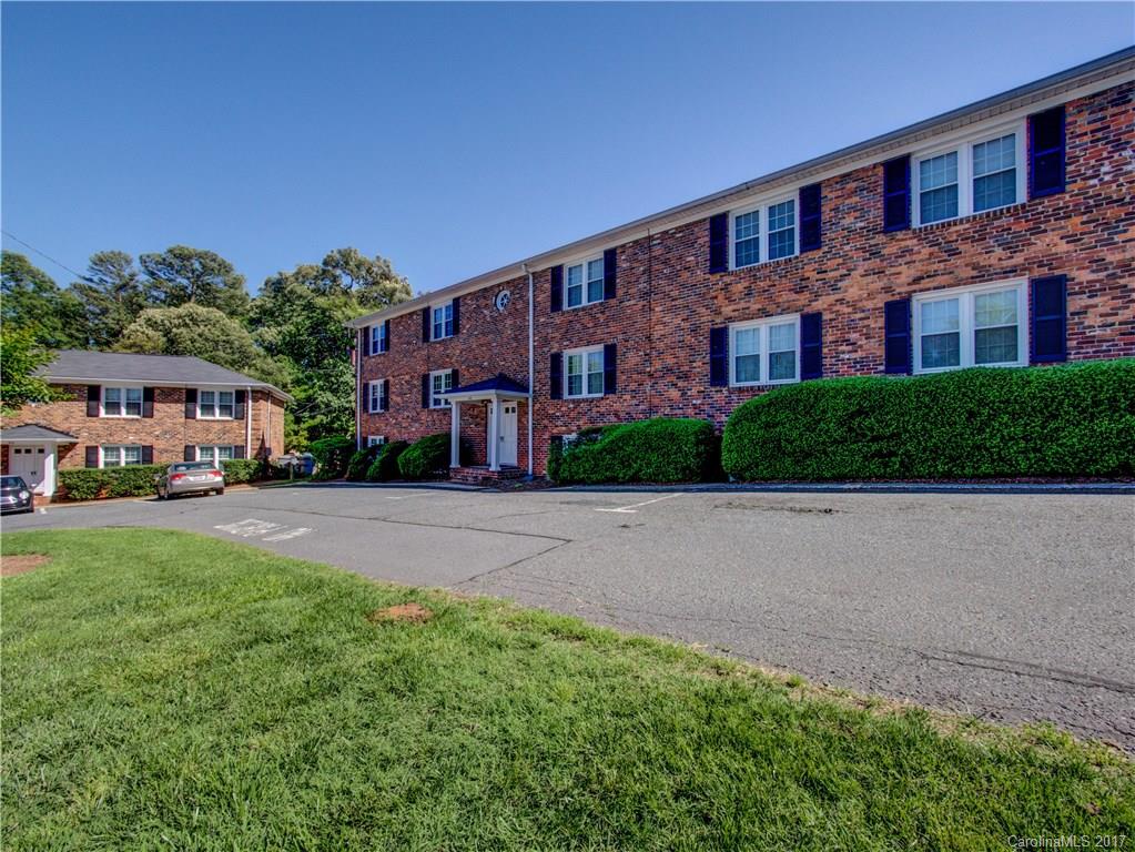 910 McAlway Road, Unit E Charlotte, NC 28211 - Photo 1 of 13 a front view of a building with a garden