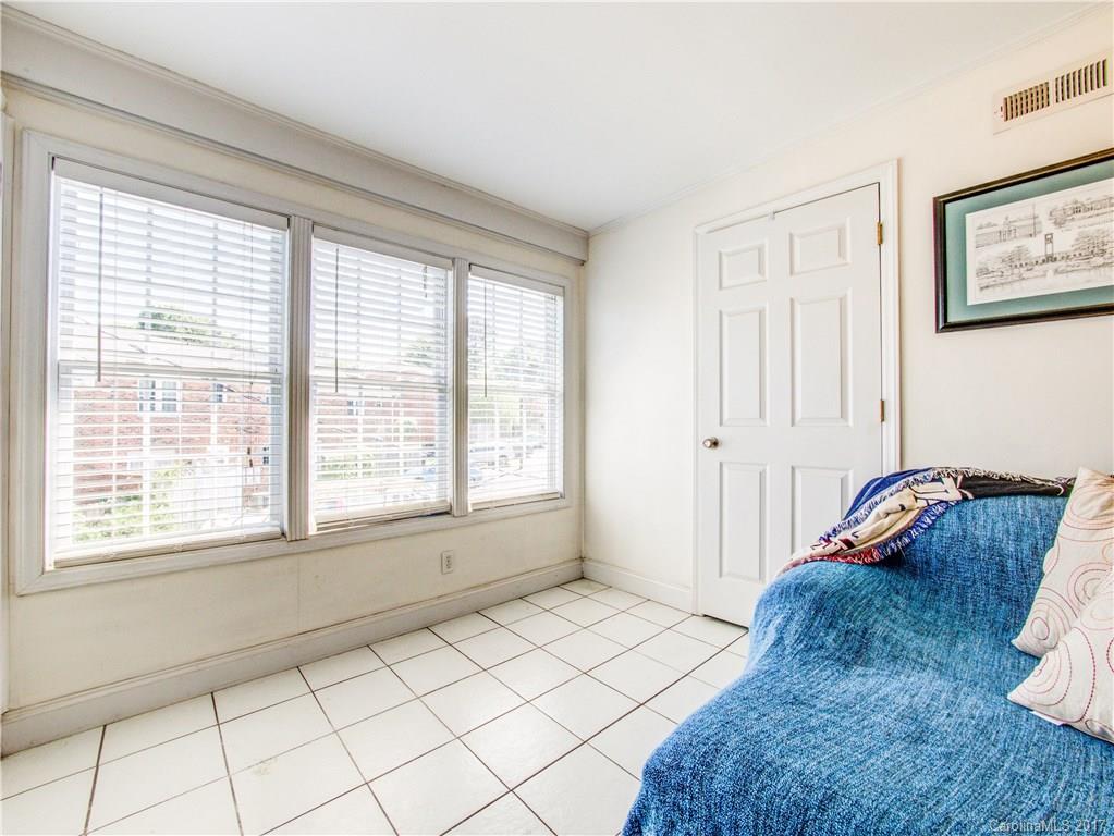 910 McAlway Road, Unit E Charlotte, NC 28211 - Photo 13 of 13 a bed room with a bed and a window