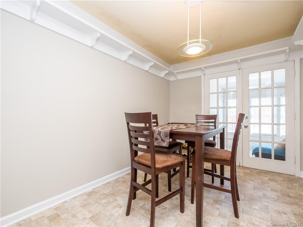 910 McAlway Road, Unit E Charlotte, NC 28211 - Photo 6 of 13 a view of a dining room with furniture and window
