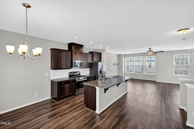 a bathroom with a sink toilet and mirror