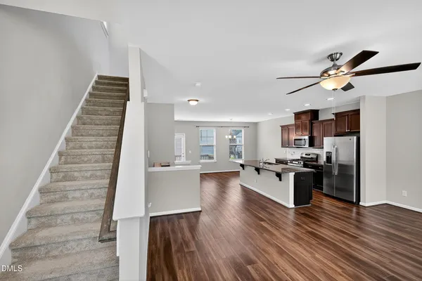 a view of a house with wooden deck