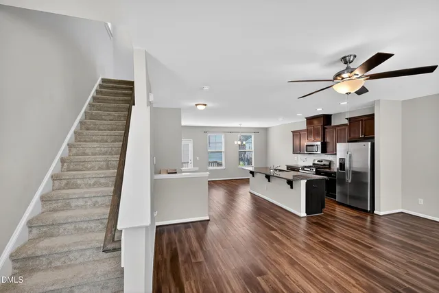 a view of a house with wooden deck