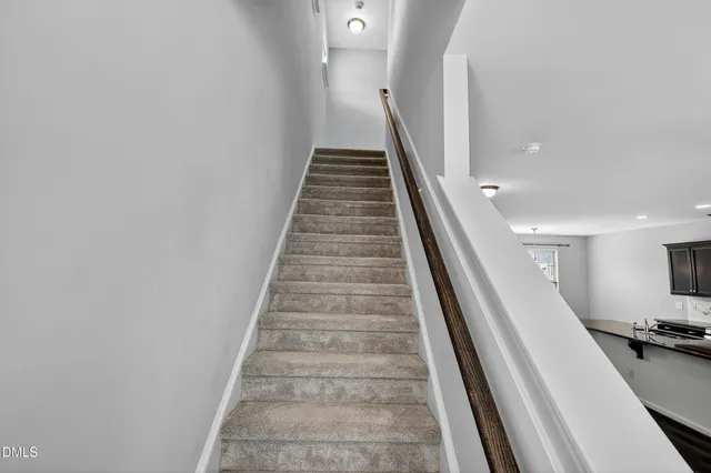 a view of kitchen with sink and microwave