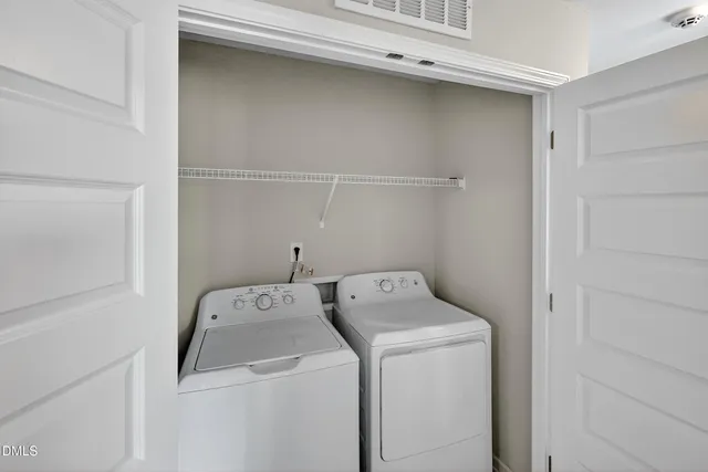 a view of a hallway with closet area