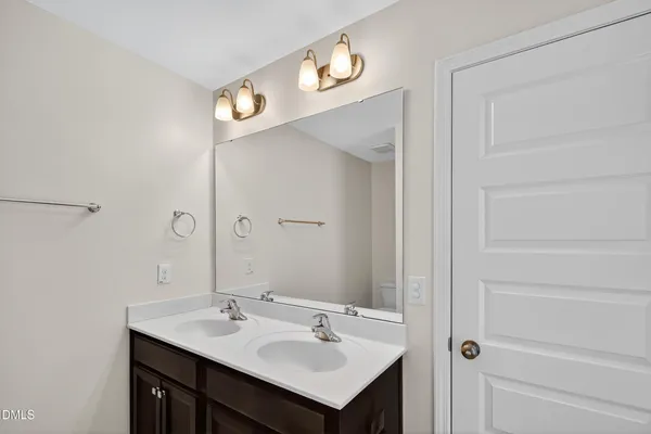 an empty room with a ceiling fan and a window