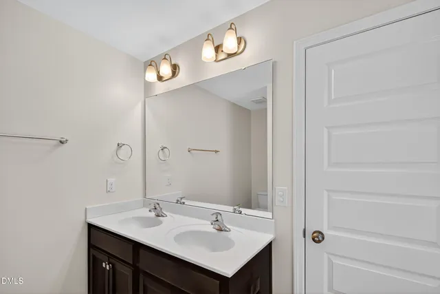 an empty room with a ceiling fan and a window