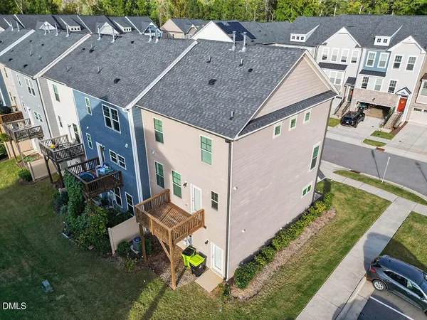 a view of a cars park in front of a house