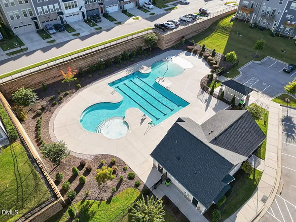 an aerial view of a house with a swimming pool