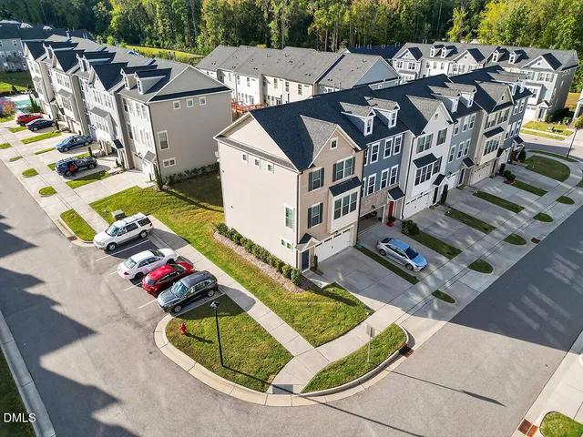 a view of a house with pool and chairs