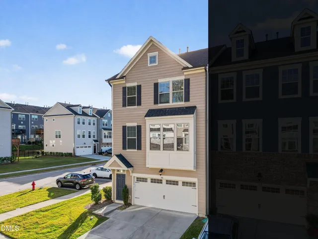 a view of a house with swimming pool next to a yard