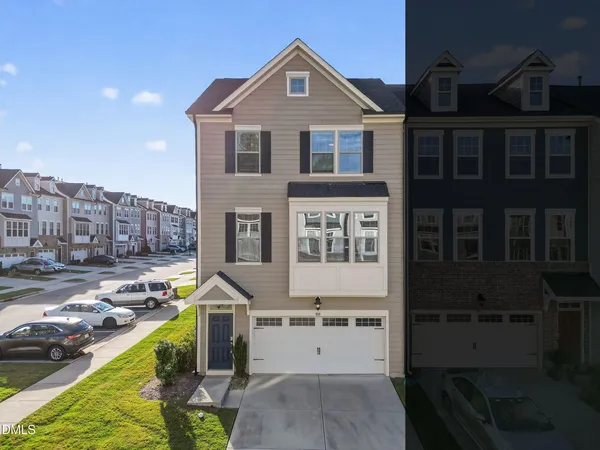 a view of a house with swimming pool next to a yard
