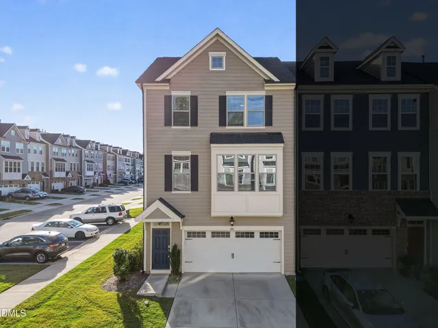 a view of a house with swimming pool next to a yard