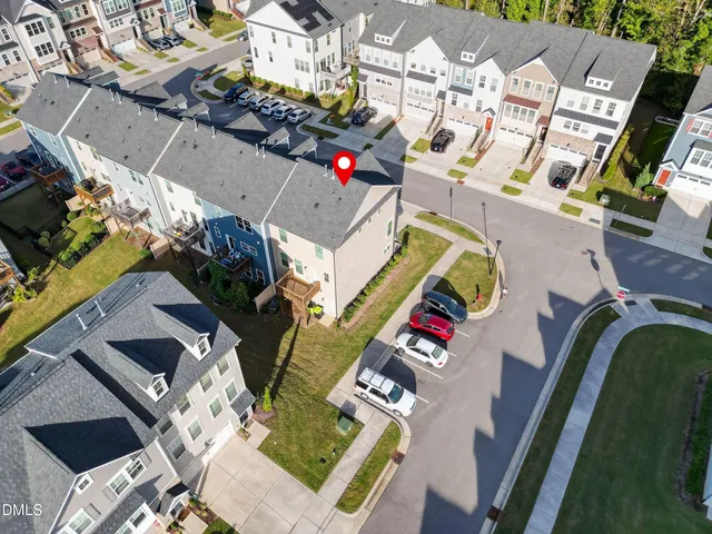 an aerial view of a house with a swimming pool