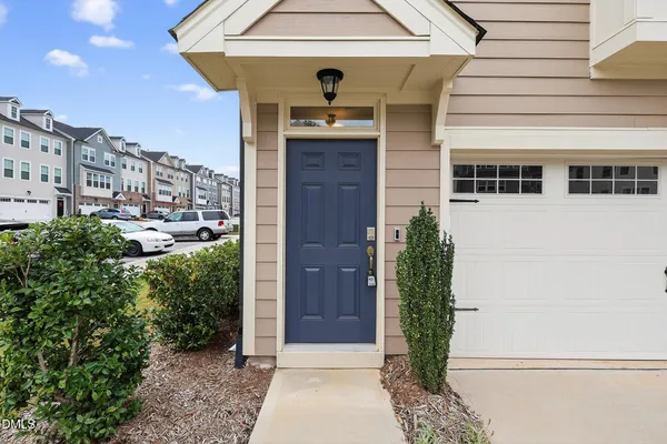 a view of residential houses with yard and mountain view