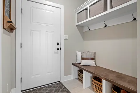 a spacious bedroom with a bed and a flat screen tv