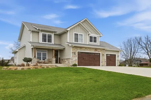 a front view of house with yard and green space