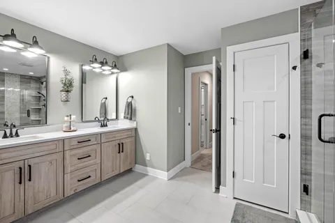 a bathroom with a bathtub and a shower