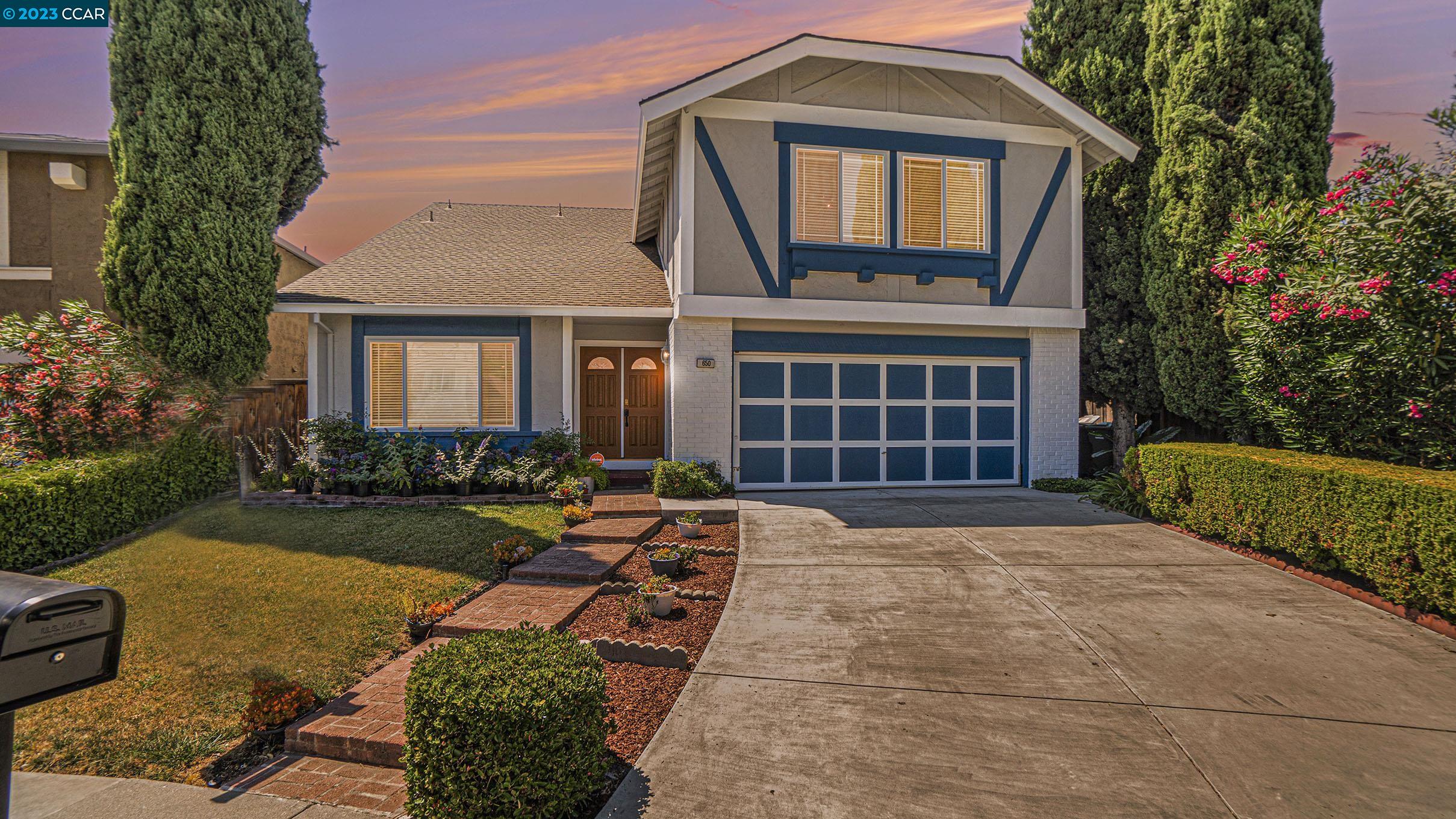 a front view of a house with garden