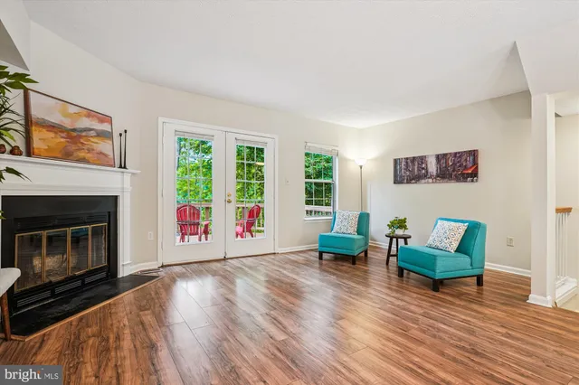 a view of deck with a table and chairs and wooden floor