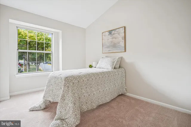 a picture of a bench in front of a wall