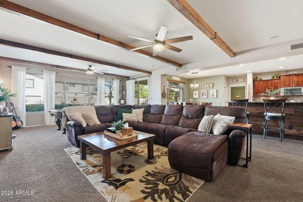 a kitchen with stainless steel appliances granite countertop a sink and a refrigerator