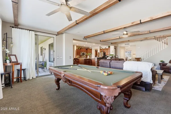 a spacious bedroom with a bed and furniture