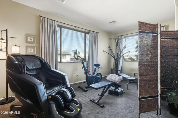 a room with lots of wooden furniture cabinets and a sink