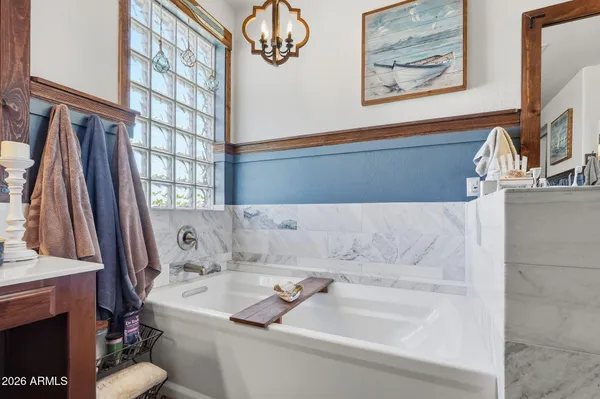 a bedroom with furniture and a book shelf