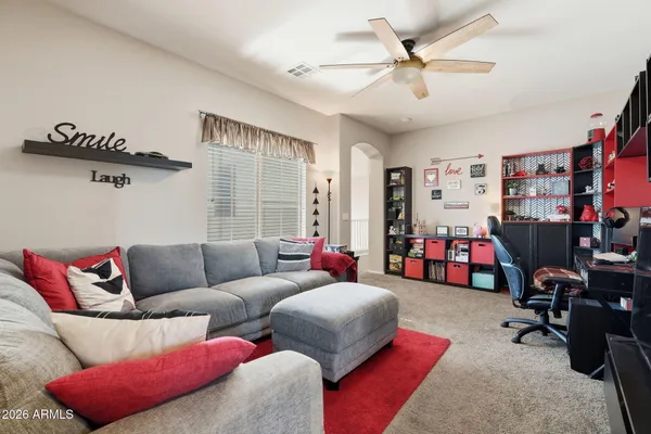 a spacious bedroom with a bed and a window