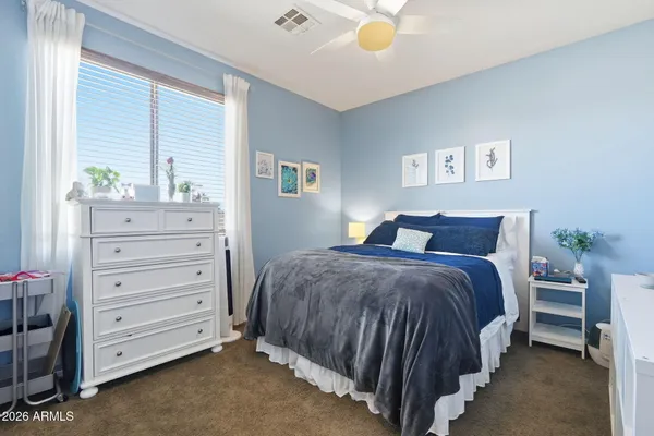 a bathroom with a granite countertop sink a toilet and bathtub