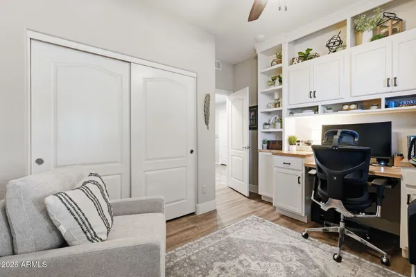 a view of living room with furniture and a floor to ceiling window