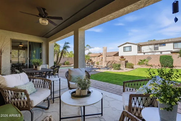a view of an outside dining space with furniture window and outside view