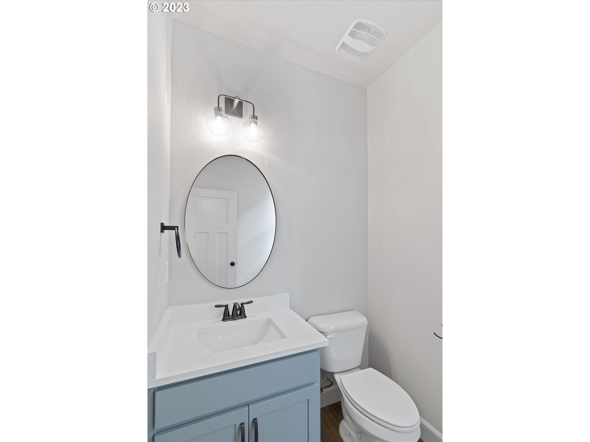 19699 Leland Road Oregon City, OR 97045 - Photo 14 of 38 a bathroom with a toilet sink vanity and mirror
